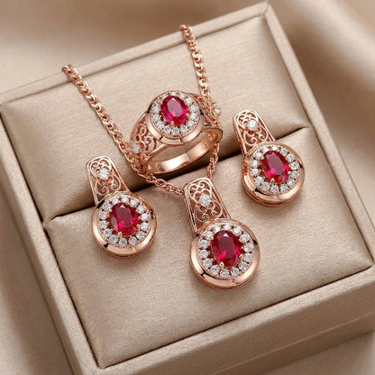 Schmuckset in Roségold mit ovalem rotem Zirkon – Ring, Ohrringe und Halskette